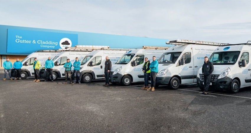 The gutter company vans and staff outside office